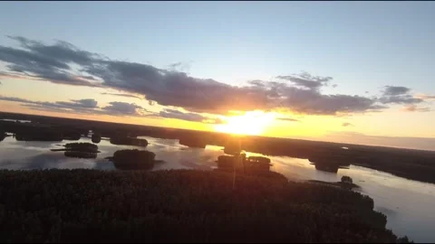 Fpv drone flight over blue lakes in a green forest over water Stock Footage 208613656