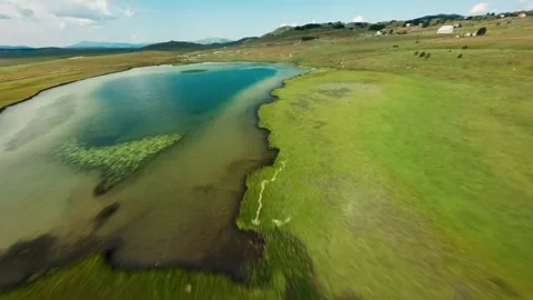 FPV Drone Flight Over Blue Lake in Montenegro – Scenic Aerial Nature Shot Video stock 305801092