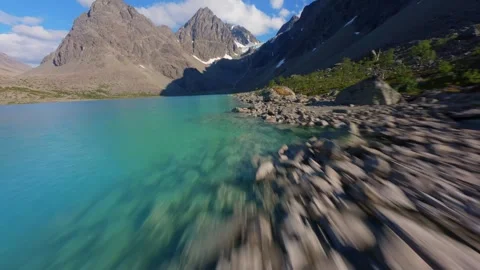 FPV Drone Flight Over Blue Lake in Norway – Scenic Aerial Nature Shot Video stock 305825033