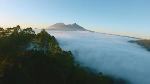 Fpv drone flight over the clouds at dawn near Batur volcano in Bali Stock-Footage 245372964