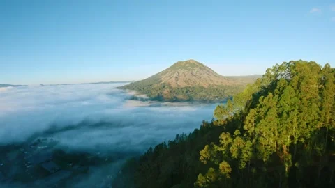 Fpv drone flight over the clouds at dawn near Batur volcano in Bali Stock-Footage 245433338