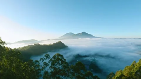 Fpv drone flight over the clouds at dawn near Batur volcano in Bali Stock-Footage 245434077