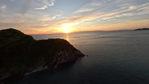 FPV Drone Flight Over Coastal Rocks at Sunset – Peaceful Ocean Landscape Video stock 336196189