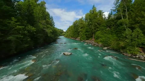 FPV drone flight over the fast moving river with rapids, close to the water. Stock Footage 263403426