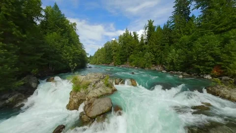 FPV drone flight over the fast moving river with rapids, close to the water. Stock Footage 276363741