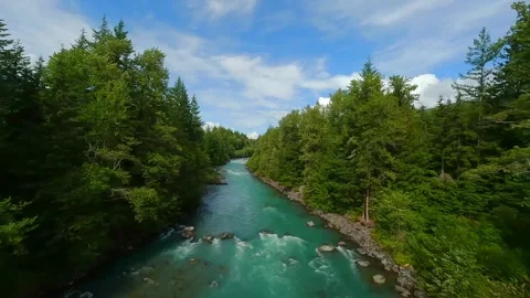 FPV drone flight over the fast moving river with rapids, close to the water. Stock Footage 278898227