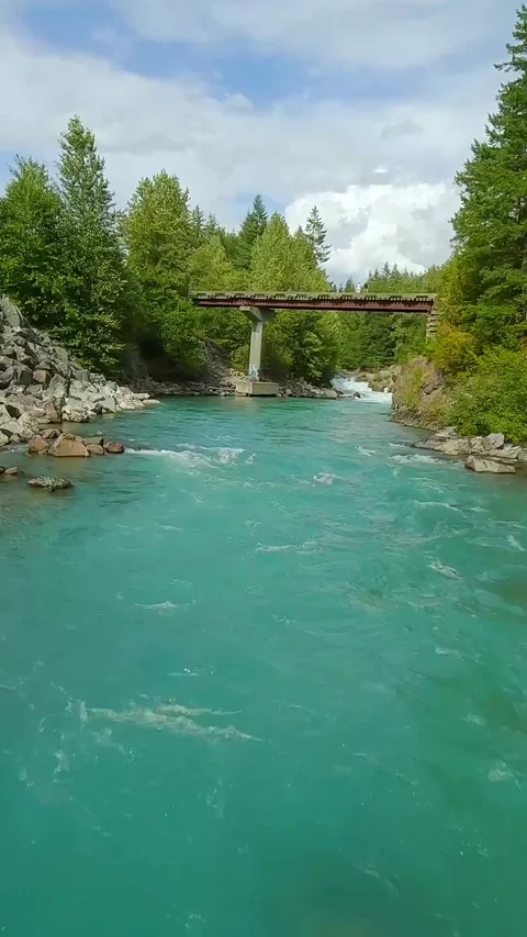 FPV drone flight over the fast moving river with rapids, close to the water. Stock Footage 322535866