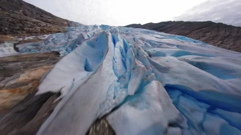 FPV Drone Flight Over Glacier Crevasses in Norway Video stock 305802324