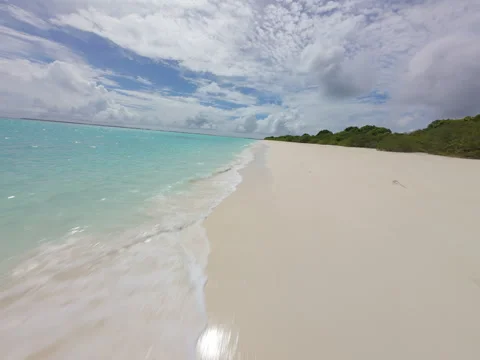FPV Drone Flight Over Maldives Shoreline with Turquoise Waves Stock Footage 314494941