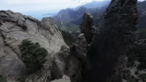 FPV Drone Flight Over Mountains Toward the Sea Stock Footage 309036448