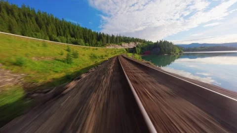 FPV Drone Flight Over Railway by Lake in Norway – Scenic Aerial Nature Shot Video stock 305801993