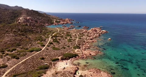 FPV drone flight over red rocky shore and turquoise Mediterranean water 스톡 동영상 347902386