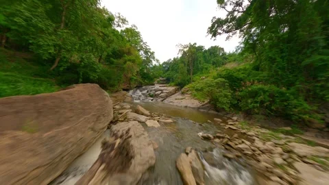 FPV drone flight over a rocky river in the tropical rainforest in Thailand Stock Footage 253055262