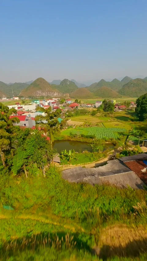 FPV drone flight over scenic Vietnamese village on Ha Giang Loop Vietnam Stock Footage 306517244