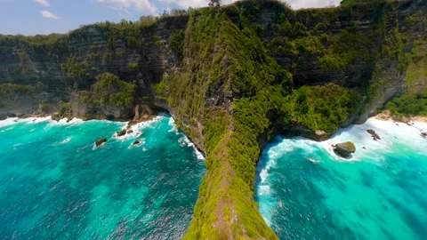 FPV drone flight over scenic cliffs and turquoise sea on Nusa Penida Island Bali Stock Footage 308726041