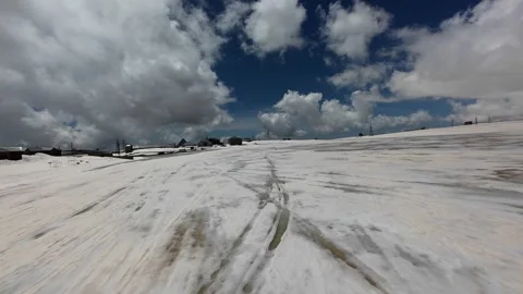 FPV drone flight over snowfields on Mount Aragats, Armenia Stock Footage 343876644