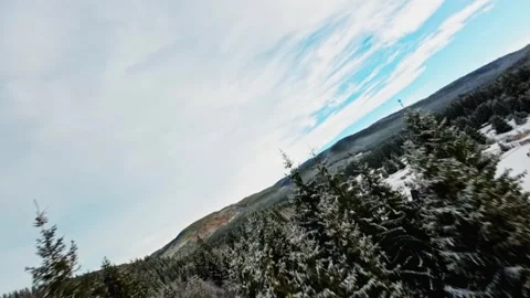 FPV Drone Flight over the Snowy Mountains of Romania 動画素材 264810415