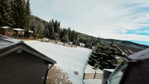 FPV Drone Flight over the Snowy Mountains of Romania 動画素材 264811836
