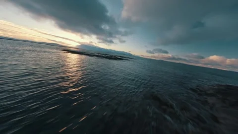 FPV Drone Flight Over Snowy Coast of Senja Norway at Sunset – Winter Aerial 4K Stock Footage 286998444