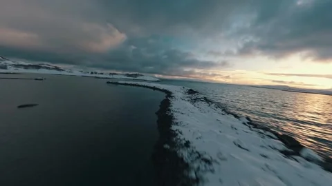 FPV Drone Flight Over Snowy Coast of Senja Norway at Sunset – Winter Aerial 4K Stock Footage 286998509