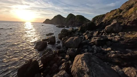 FPV Drone Flight Over Sunset Sea and Coastal Rocks in Wakayama, Japan Video stock 336195656