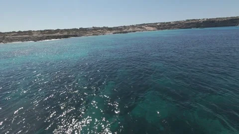 FPV Drone Flight Over Turquoise Sea Near Spanish Island Coast Stock Footage 340879436