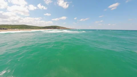 FPV drone flight over turquoise water and waves at Veleka Beach on the Black Sea Stock Footage 342737733
