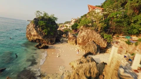 Fpv drone flight over the white sand beach at sunset in bali Stock-Footage 245363070