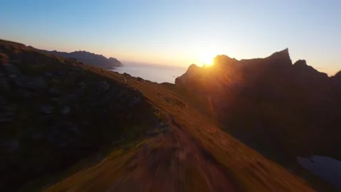 FPV Drone Flight Into Sunset Over Mountains on Senja Island, Norway Video stock 305824998