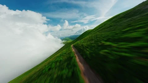 FPV Drone Flight Through Cloud and Over Meadow in Umbria, Italy Stock Footage 305800024