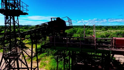 FPV Drone Flight Through Idle Quarry With Industrial Processing Machinery Video stock 335685213