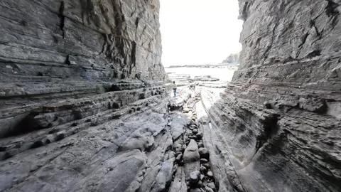 FPV Drone Flight Through Torige Cave to the Ocean in Wakayama, Japan Video stock 335579902