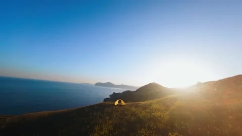 FPV drone fly over hill on seashore Stock Footage 164925290