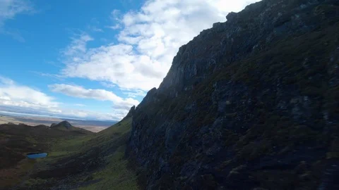 FPV drone flying along huge rock face drone aerial 4K Stock Footage 104577372