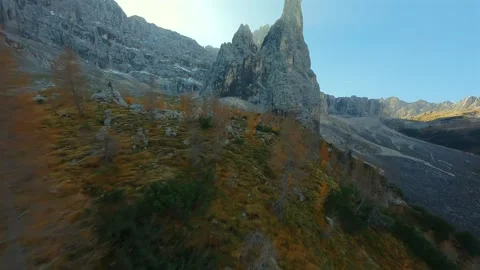 FPV drone flying along the sharp cliffs of Cristallo mountain in Dolomites Stock Footage 307863406