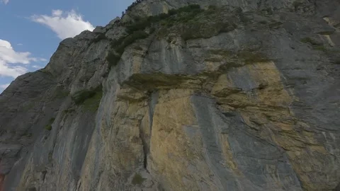 FPV Drone Flying Close to Rocky Cliff in Swiss Alps Stock Footage 313074094