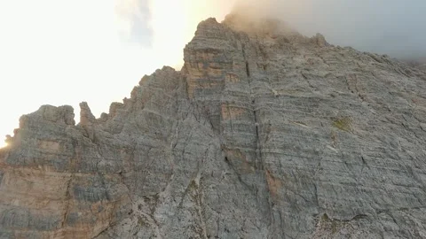 FPV drone flying close to the sharp mountain cliffs. Italy, Dolomites Stock Footage 293637615