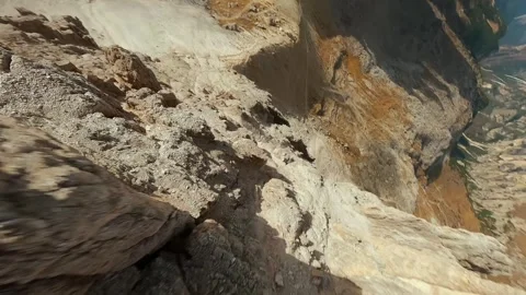 FPV drone flying close to the sharp mountain cliffs. Italy, Dolomites Stock Footage 295293446
