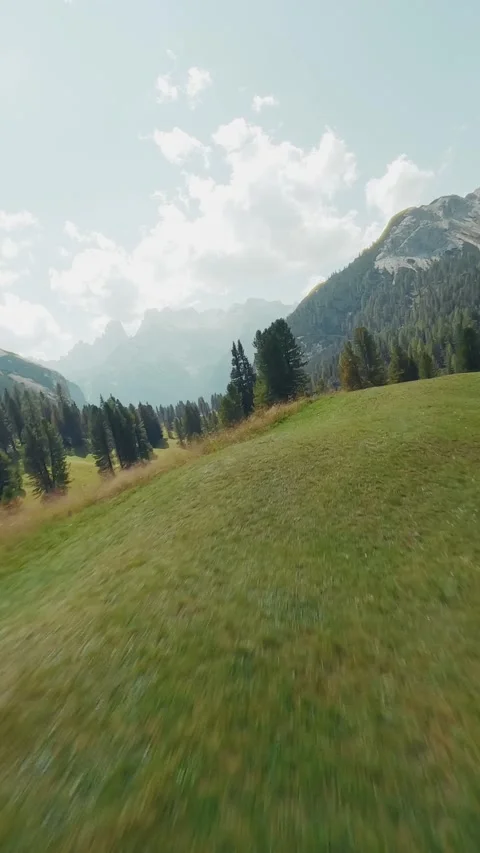 FPV drone flying in Dolomites - Vertical Stock Footage 283892372