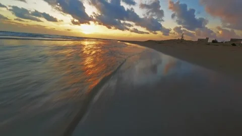 FPV drone flying fast along a beach Stock Footage 294800715