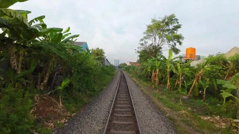 FPV drone flying low along railway tracks 動画素材 289261400