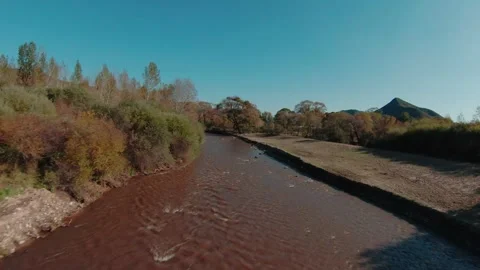 FPV drone flying low and fast over the river in autumn.4K stock video Stock Footage 293325486