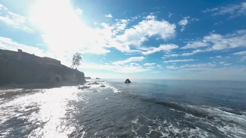 FPV Drone Flying Low Over Waves Near Rocky Coast 스톡 동영상 220619998
