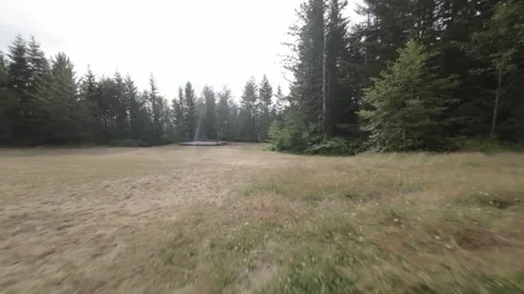 FPV Drone Flying Low Towards Wooden Platform (Desaturated) Stock Footage 246301502