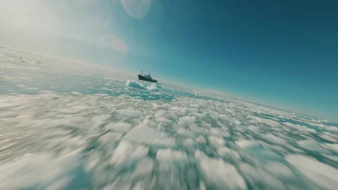 FPV drone flying over Arctic sea ice toward ship in Svalbard waters Видео 331129529