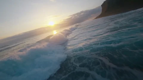 FPV Drone Flying over Powerful Ocean Waves at Golden Sunset, Nusa Penida Stock Footage 327411445