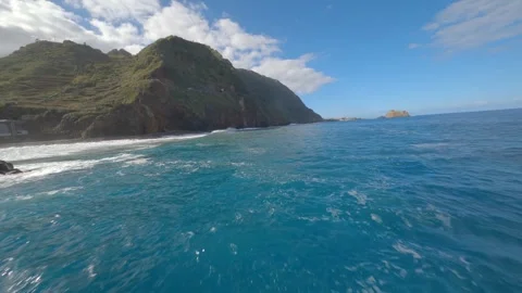 FPV drone flying over the sea near the coast and rocks in Madeira, Portugal Stock Footage 253555431