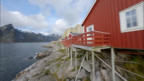 FPV Drone Flying Past Red Rorbu in Lofoten 스톡 동영상 308729225