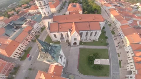 FPV drone flying really close to a chruch and then diving down Stock Footage 169280504