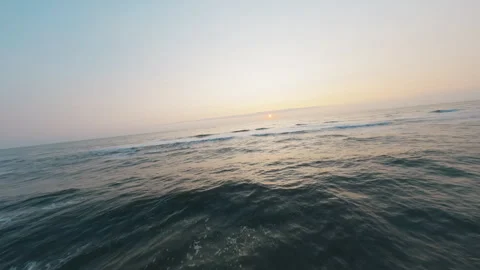 FPV Drone Flying From Sandy Beach Into Ocean Sunset, Low Flight, Portugal Stock Footage 327413650